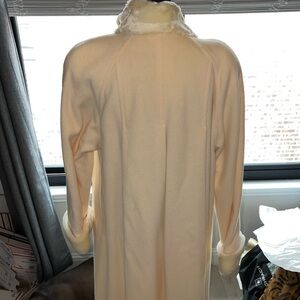 Cream wool trench with faux fur collar and cuffs.